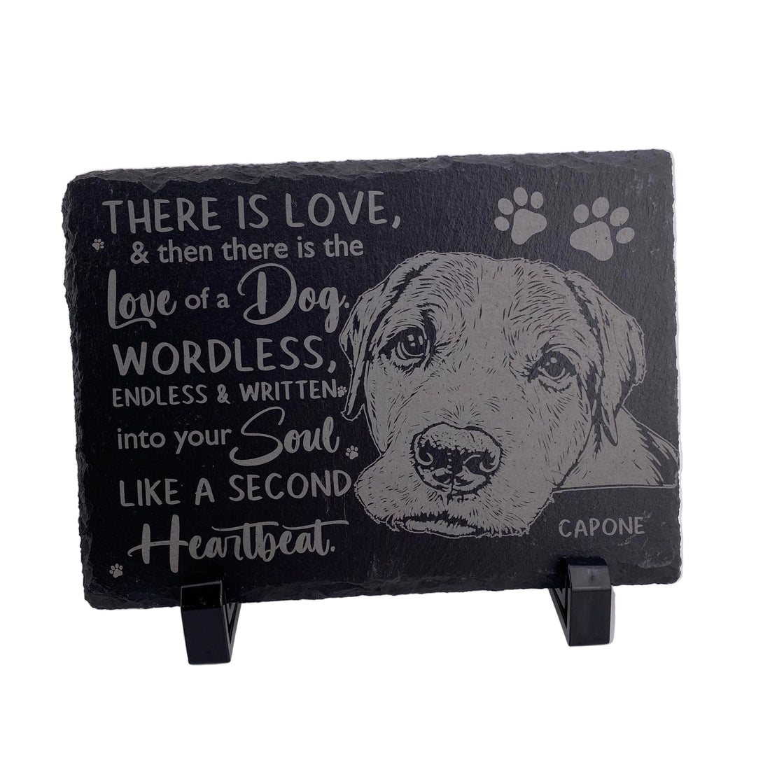 Slate plaque with a dog's face and engraved text on a white background