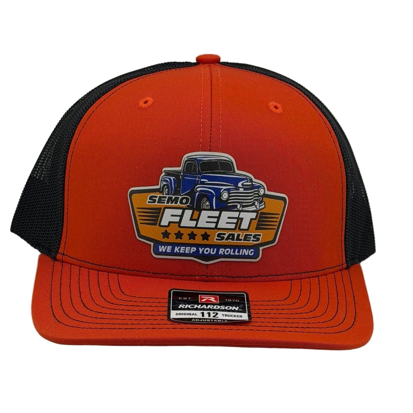 Orange and black cap with a logo on a white background