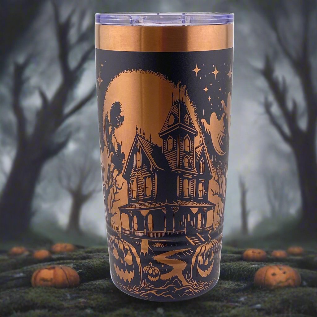 A 20oz stainless steel polar camel tumbler with a black and rose gold color scheme, featuring a haunted house and moon and stars pattern.