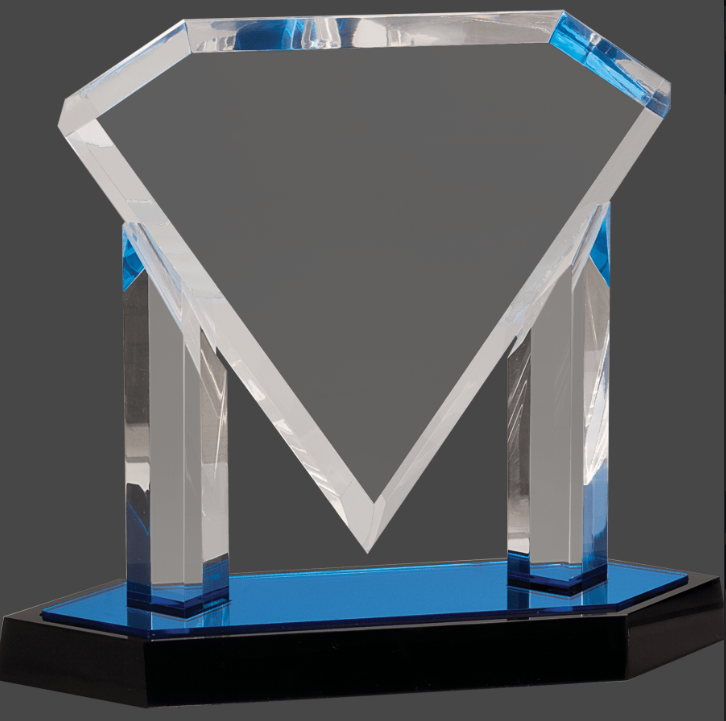 An acrylic award in the shape of a diamond with a reflective surface, featuring a personalized engraving plaque on a mirror base, primarily in blue color.