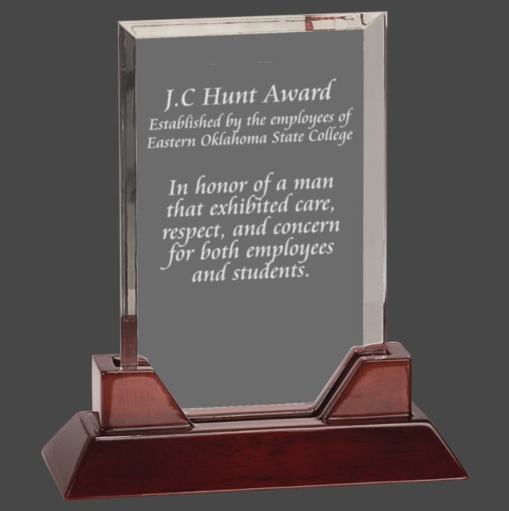 Rectangle acrylic award with a rosewood piano finish base, featuring engraved text.