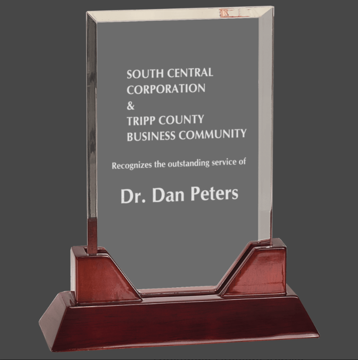 Rectangle acrylic award with a rosewood piano finish base, featuring engraved text.