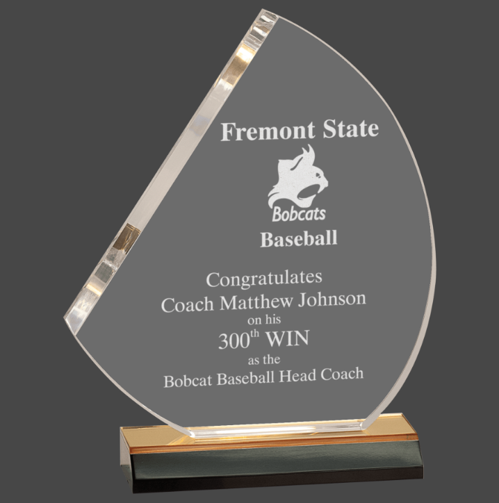 An acrylic award with a reflective silver finish, featuring a gold base, and engraved text including 'Fremont State Baseball' and 'BOBCATS BASEBALL HEAD COACH' along with a congratulatory message.