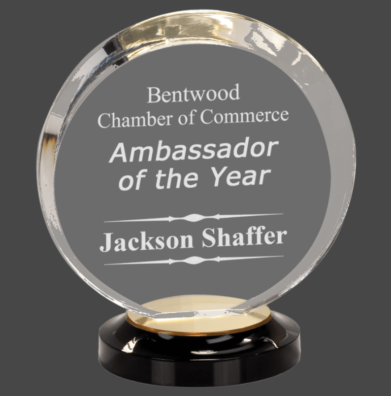 An engraved acrylic award with a black base, featuring text that reads 'Bentwood Chamber of Commerce Ambassador of the Year' along with a personalized message 'Jackson Schafer'.
