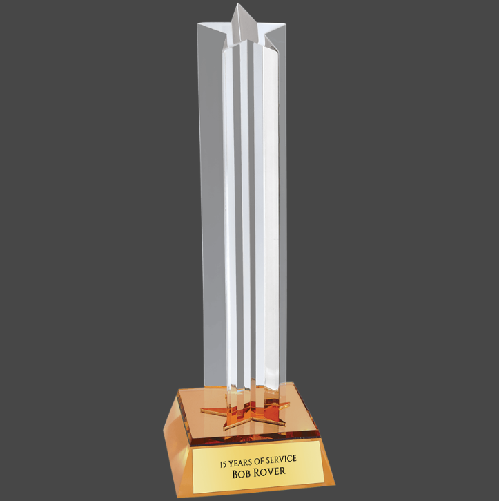 An 8 1/2 inch tall acrylic award with a star column design and a gold-colored base that reads 'Top Performer Bob Royer'.