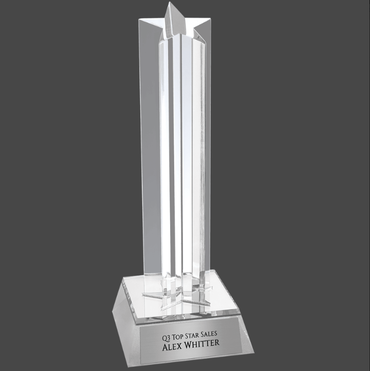 An acrylic award with a silver base, featuring a clear star column and a personalized plaque that reads 'Q1 Top Sales Alex Whitter'.