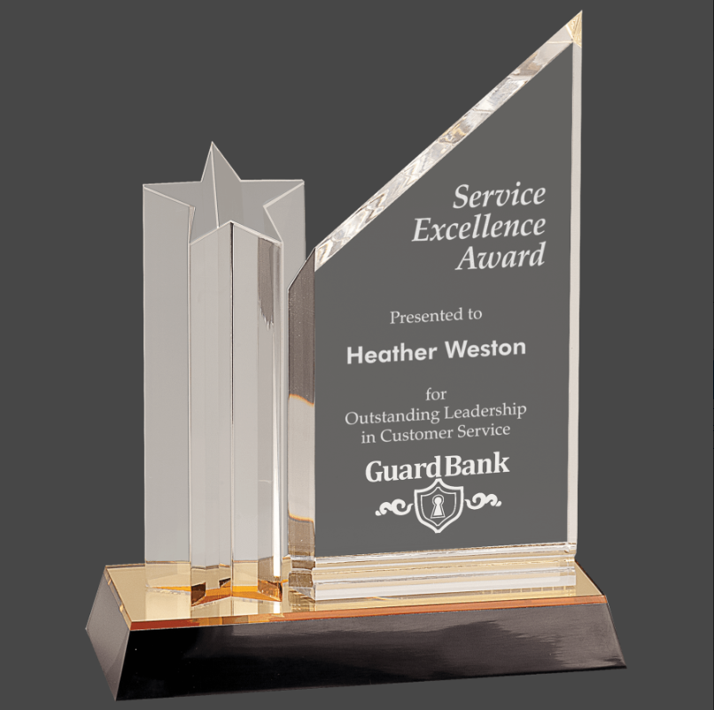 An acrylic trophy with a clear plaque that reads 'Service Excellence Award' and a gold/black base, presented to Heather Weston for leadership in customer service.