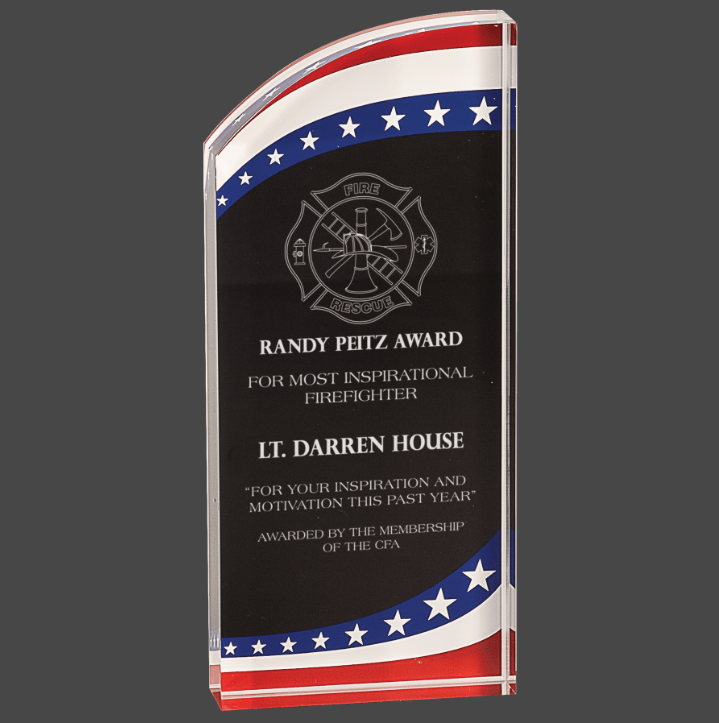 An acrylic award with a marbleized design featuring stars and stripes in red, white, and blue colors, with personalized engraving text.