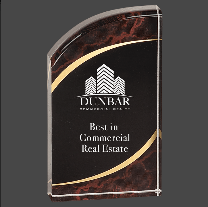 A red marbleized acrylic award with a black and gold engraving plate.