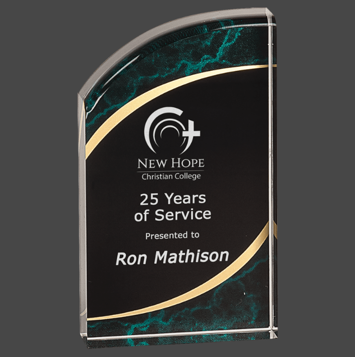 A green marbleized acrylic award with a black and gold engraving plate.