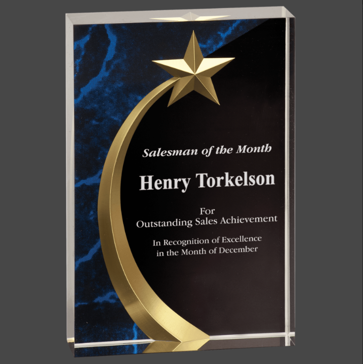 A square-shaped acrylic award with a shooting star and text recognition, standing on a black base with a blue marble-like pattern.