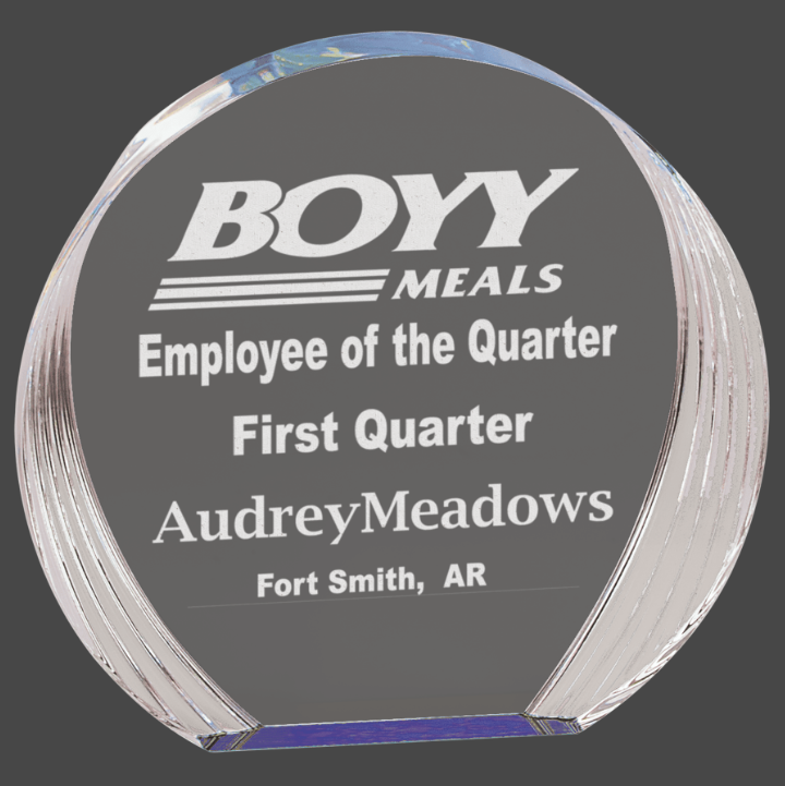 A blue round acrylic award with a custom laser engraving plaque that reads 'BOY MEALS EMPLOYEE OF THE QUARTER FIRST QUARTER AUDREY MEADOWS FORT SMITH, ARKANSAS'.