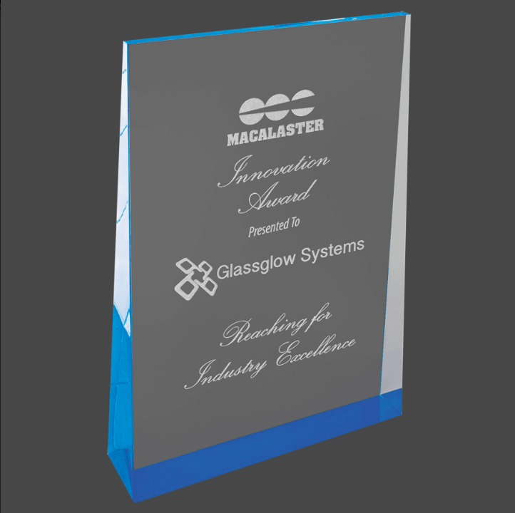 A blue acrylic wedge award with custom laser engraving text and logo.