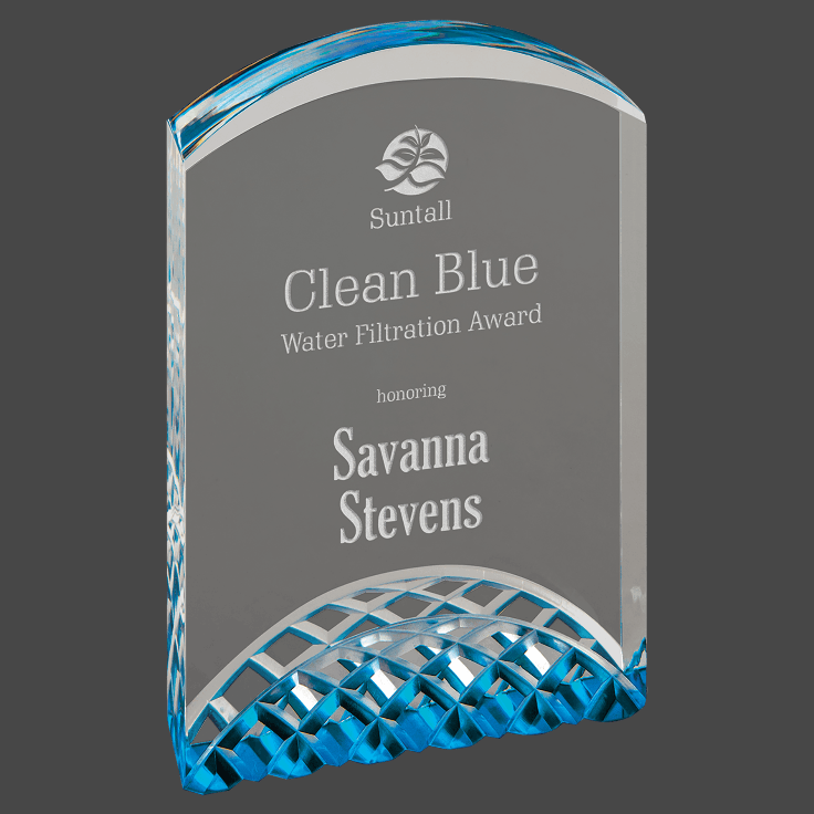 A blue acrylic award with a custom laser engraving of a logo and text