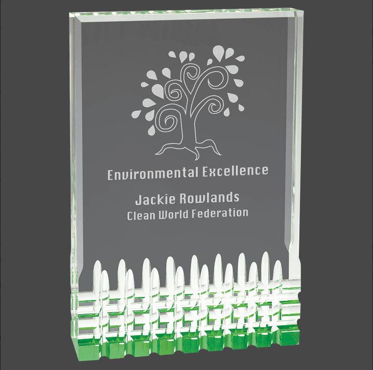 A green tinted acrylic award with a personalized engraving plate that reads 'Environmental Excellence' and includes a tree graphic.