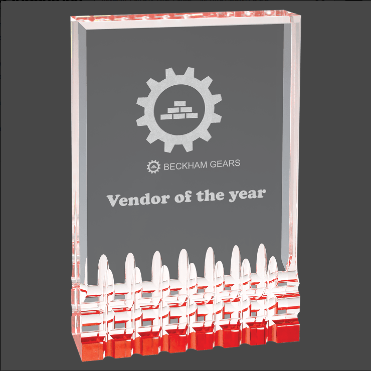 A Red and Clear acrylic award with a custom laser engraving of a logo and text