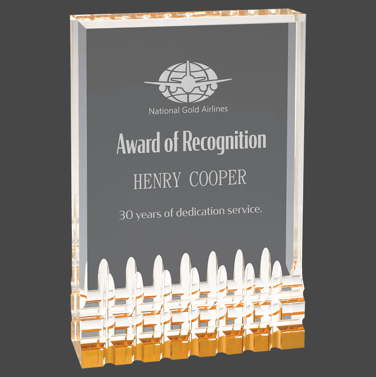 A gold mirage acrylic award with custom laser engraving, featuring text and a logo.