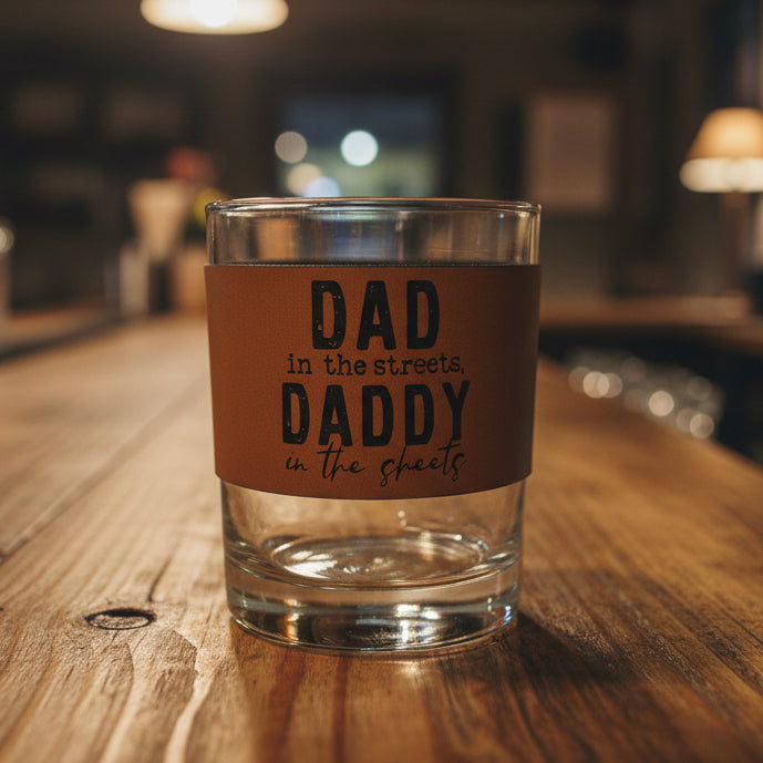 Clear glass with a brown label reading 'DAD in the streets, DADDY in the specials' on a white background.